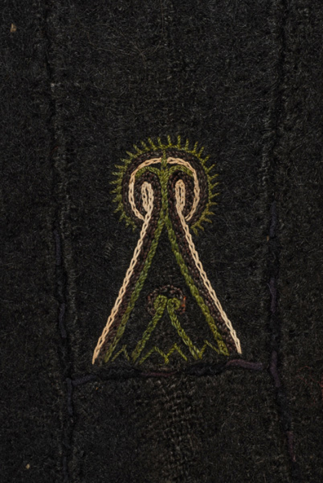 Detail of the decoration at the side, embroidered stylized motif