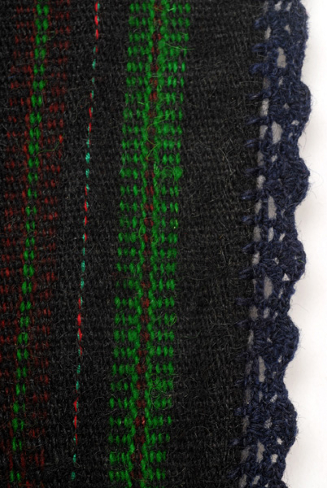 Detail of the decoration: embellished stripes and lace crafted with embroidery needle