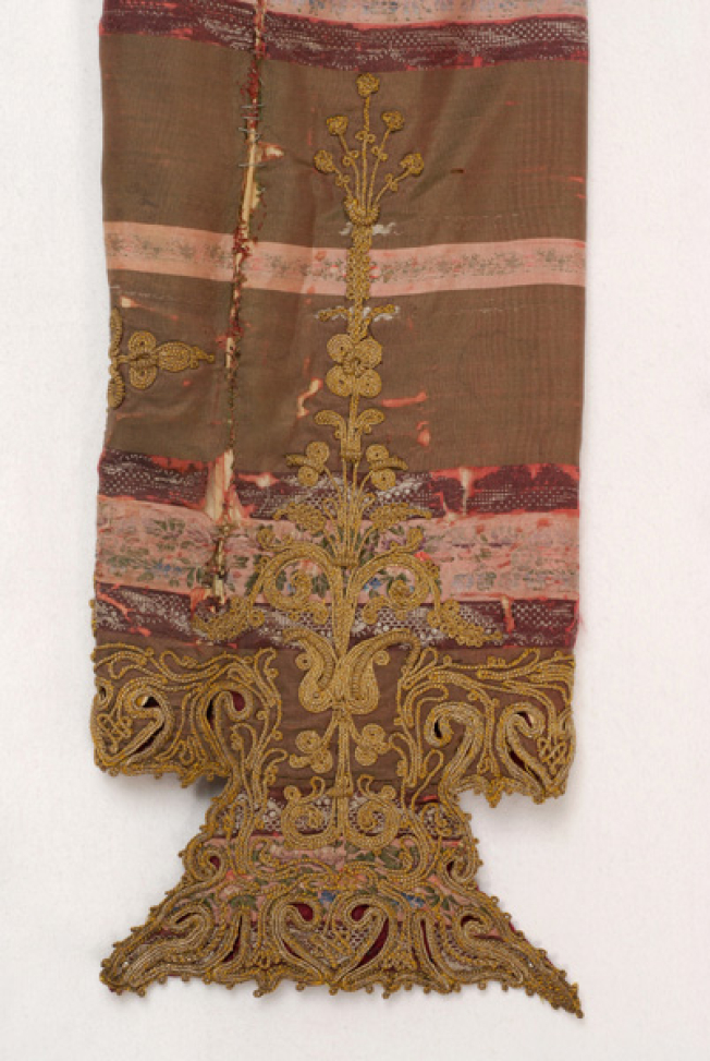 Detail of terzidikos (gold tailored) decoration at the front of the sleeve: big, stylized vegetal motif that runs from the sleeve end