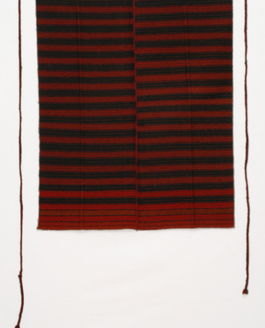 Pileno, woven woollen apron with fringed edges