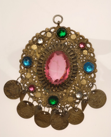 Gold-plated filigree rosette decorated with colourful glass stones and gilded coins, part of the long kordoni from Attica