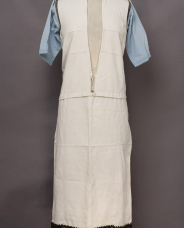 White cotton chemise, embroidered with black woollen threads