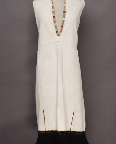 White cotton sleeveless chemise, embroidered with black woollen threads