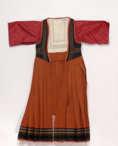 Foustani (dress) made of cinnamon coloured woollen fabric, ornamented with karelisia embroideries (multicoloured stitches)
