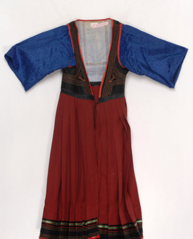 Foustani (dress) made of crimson woollen fabric, ornamented with karelisia embroideries (multicoloured stitches)