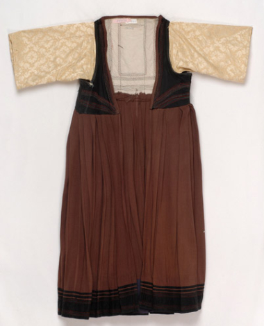 Foustani (dress) made of brown woollen fabric, ornamented with karelisia embroideries (multicoloured stitches)