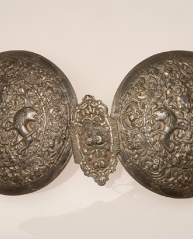 Assimozounaro, hammered silver buckles with impressive embossed decoration featuring stylized vegetal and zoomorphic themes