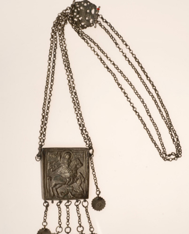 Silver charm with a representation of Saint George and pendants