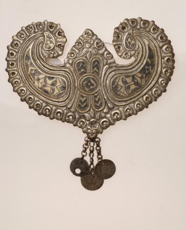 Koumptsi, heart-shaped cast plate with engraved anthropomorphic compositions filled with black "savati" (kind of enamel)