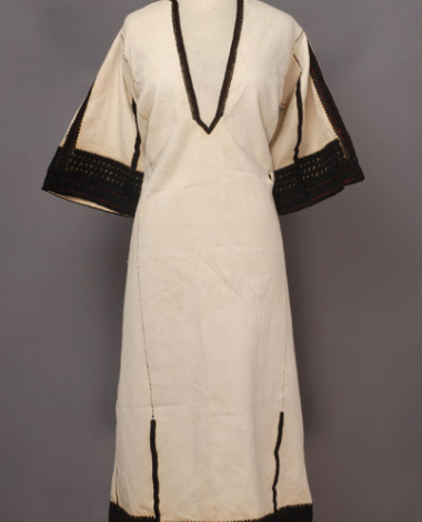 White cotton chemise, embroidered with with black woollen threads 
