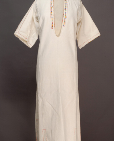 White cotton woven chemise, ornamented with mat and glistening beads and spangles 