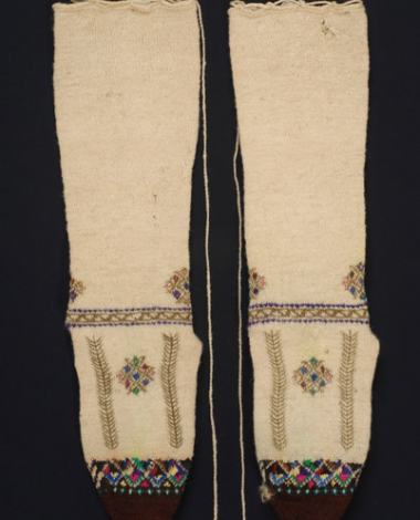 Stockings with rich decoration with mytoftera and ploumia (finery)
