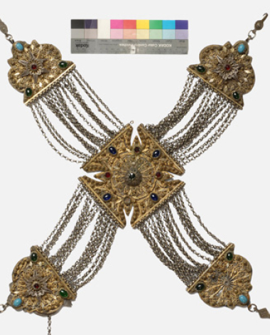 Gilded crossed kiousteki of the chest, with wiry decoration and coloured stones 
