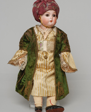Porcelain doll of the Queen Olga collection in the festive costume worn by women from Patras