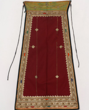 Karagounian apron made of crimson felt, embroidered with white and gold cordon along with a few coloured outres (silk braids)