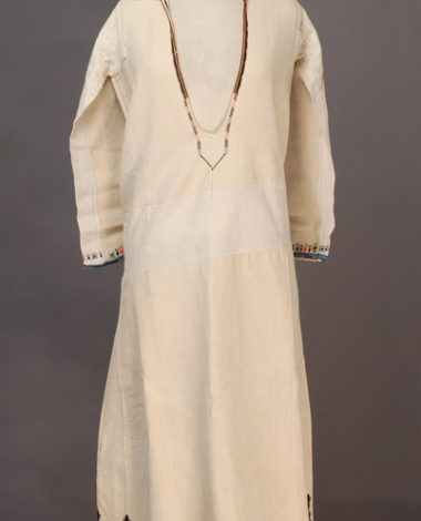 White cotton woven chemise, embroidered with woollen and cotton coloured threads