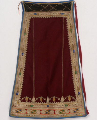 Karagounian apron made of crimson felt. Decoration with gold and white cordons and coloured outres (braids) 