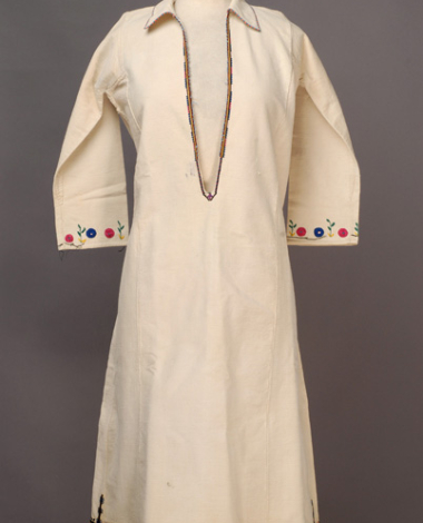 White cotton woven chemise, embroidered with woollen and silk coloured threads