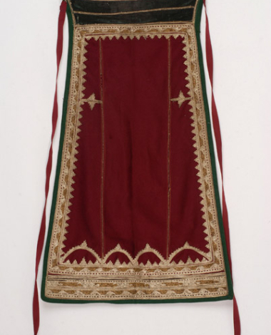 Karagounian apron made of crimson felt. Decoration with gold and silver cordons 