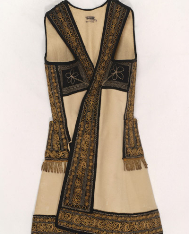Whitish felt sigouni, sleeveless overcoat decorated with applique pieces of black felt with stitches and gold embroidery