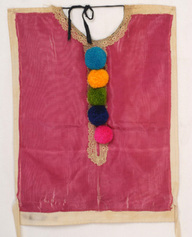 Plastron, pectoral accessory of women's costume from Alona, ornamented with applique lace sold by the metre and coloured woollen small tassels (pon-pon)