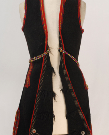 Woollen sigouna, sleeveless overcoat made of saddle blanket decorated with colouful seradia, silver cordons and coins fastened with beads
