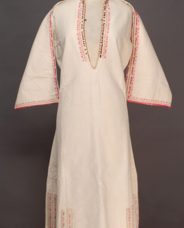 White cotton woven chemise with upright small collar, ornamented with spangles, coloured beads and multicoloured embroideries