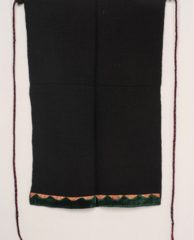 Woven apron made of black woollen dimity fabric, accessory of the women's costume from Psarades (Prespes)