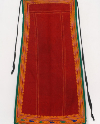 Red skoutisia apron embroidered with multicoloured silk outres (silk braids)
