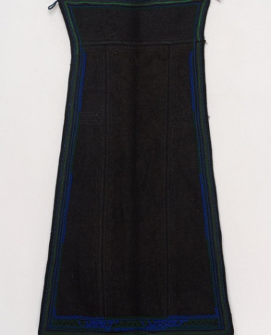 Skoutisia (woollen) apron in black colour, embroidered with woollen dark coloured woollen outres (silk braids)
