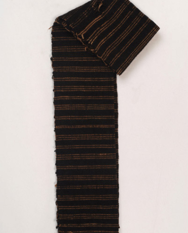 Woollen woven sash in dark brown colour with embellished horizontal thin stripes, folded lengthwise 