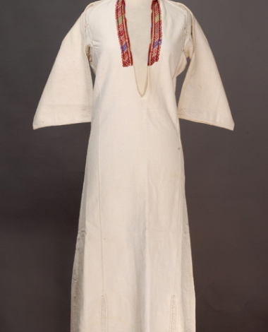 White cotton woven chemise, ornamented with woollen coloured embroideries