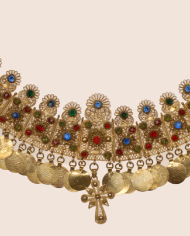 Gilt yordani, filigree pectoral ornament decorated with colourful glass stones, gilded coin imitations and a filigree cross