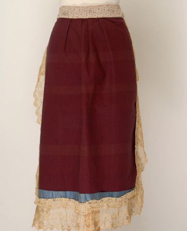 Velvet apron trimmed with lace sold by the metre