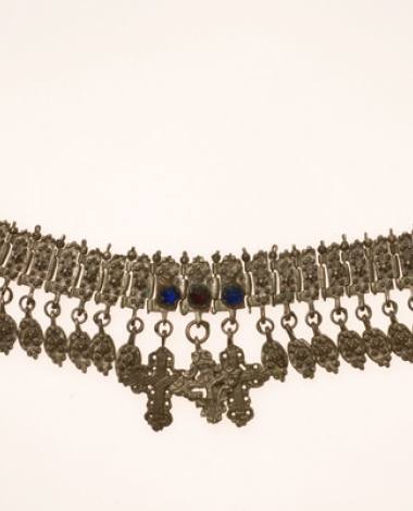 Giordani, silver ornament made of vertical cast talbets with grainy decoration and coloured glass stones.