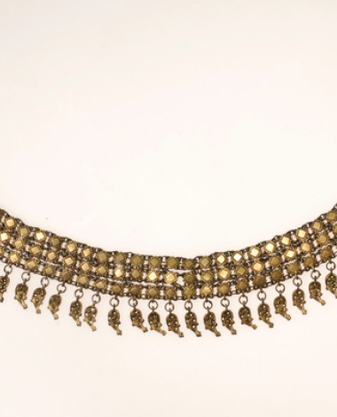 Gold plated choker crafted in the flowing technique. It ends to leave-shaped tetramidia ornamented with grainy and flimsy technique